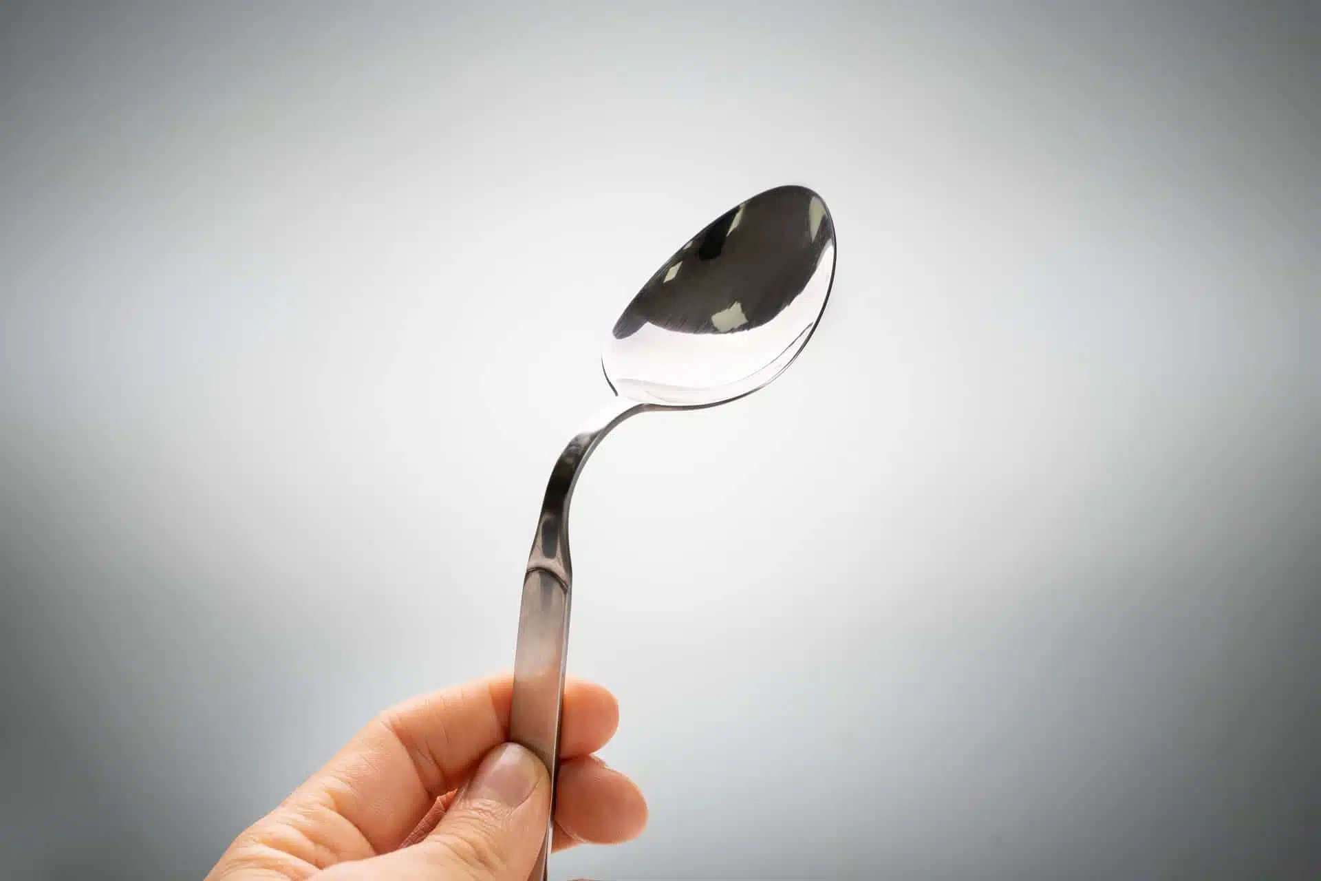 a metal spoon bent through the power of telekinesis