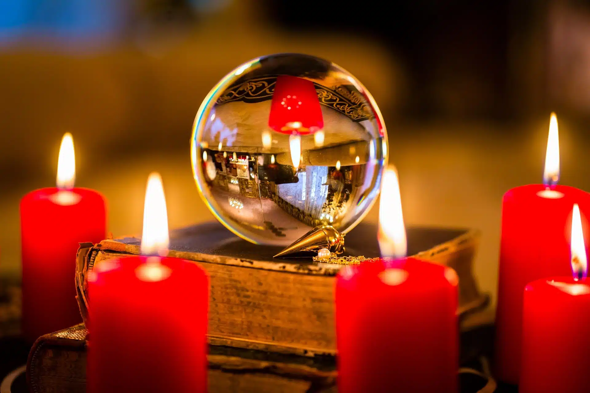 Crystal ball in the candle light to prophesy